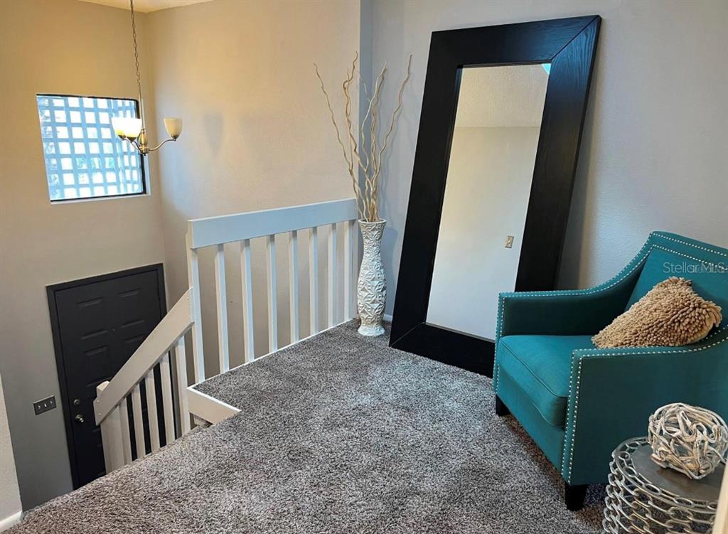 Stairs with original carpet before renovation